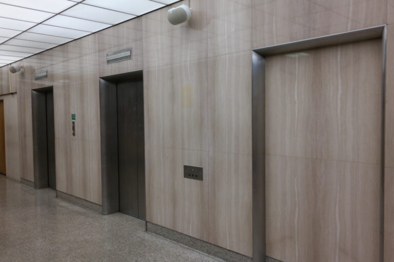 Elevator bank side