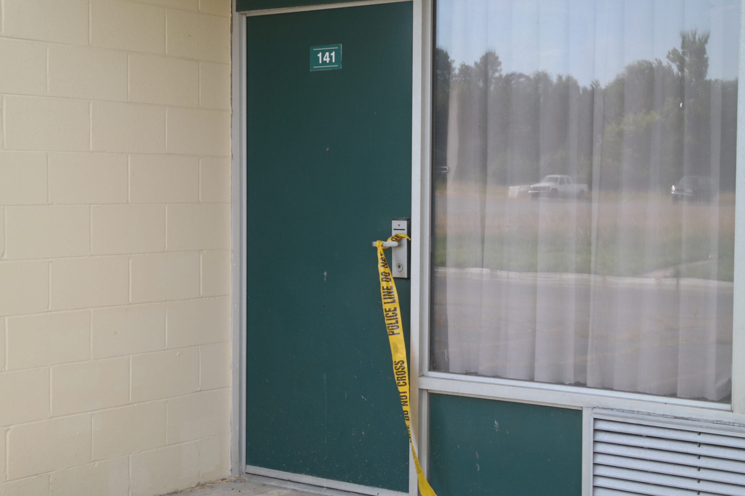 Hotel door with Police Line tape
