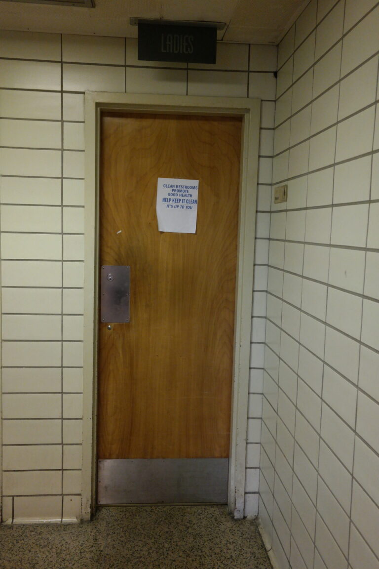 Ladies room sign over bathroom door