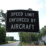 Speed Limit Enforced By Aircraft Road Sign in Suffolk, Virginia