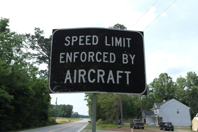 Speed Limit Enforced By Aircraft Road Sign in Suffolk, Virginia