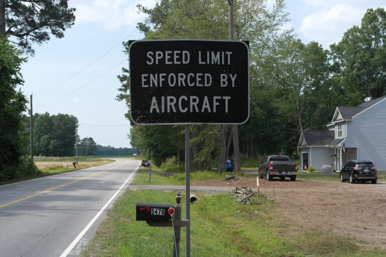 Speed Limit Enforced By Aircraft Road Sign in Suffolk, Virginia